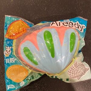 Areedy pastel seashell squishy toy